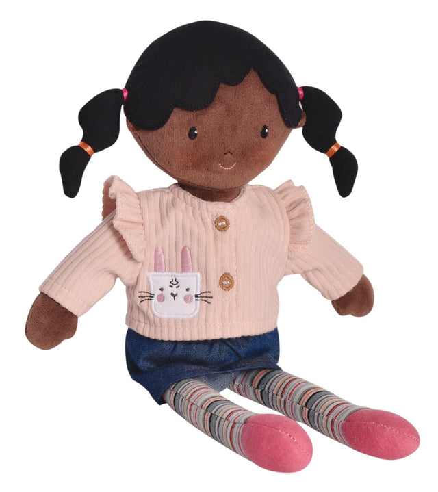 Poupée aux cheveux noirs en pull rose et leggings rayés