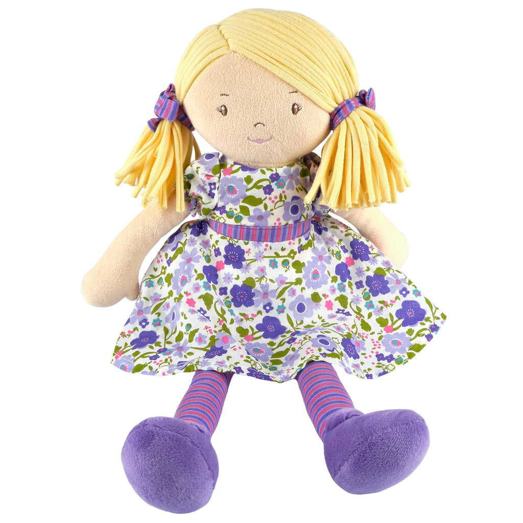 Blondhaarige Puppe in fliederfarbenem und rosafarbenem Kleid