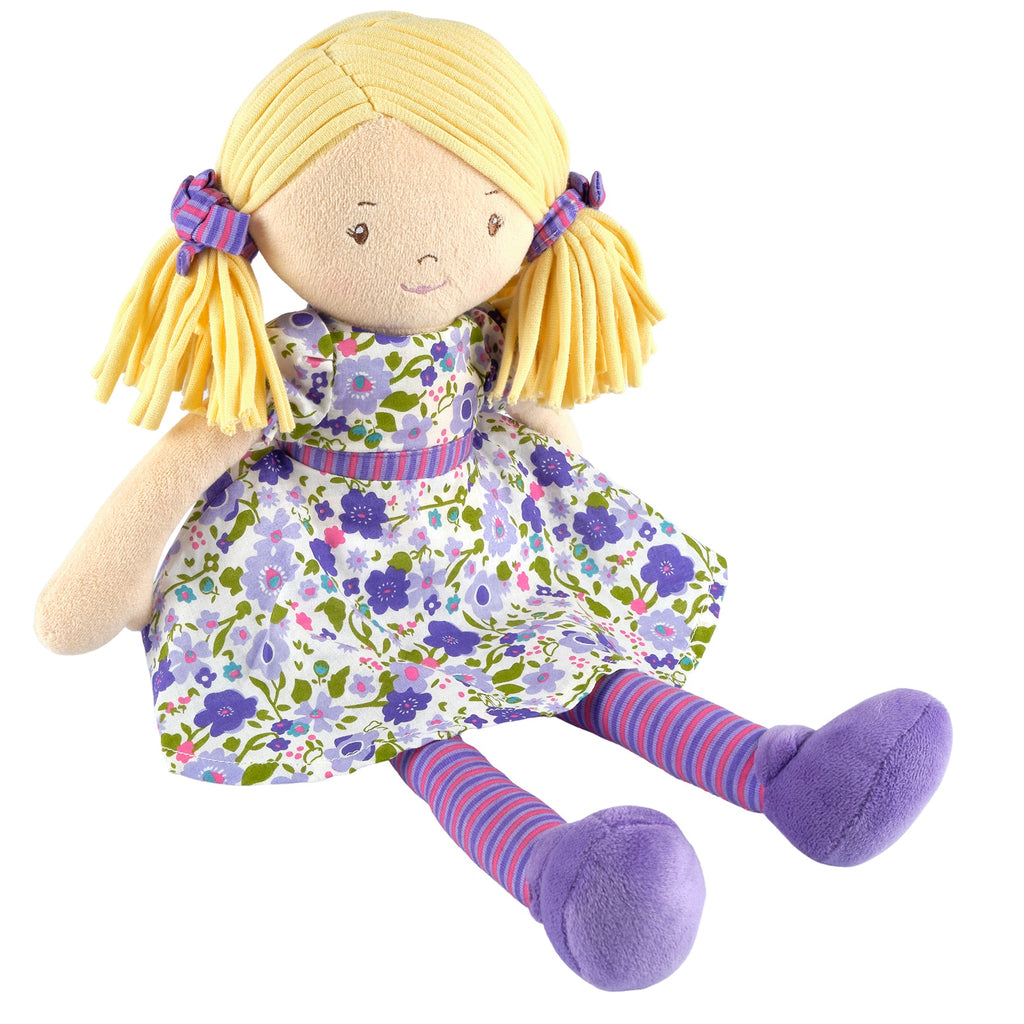 Blondhaarige Puppe in fliederfarbenem und rosafarbenem Kleid
