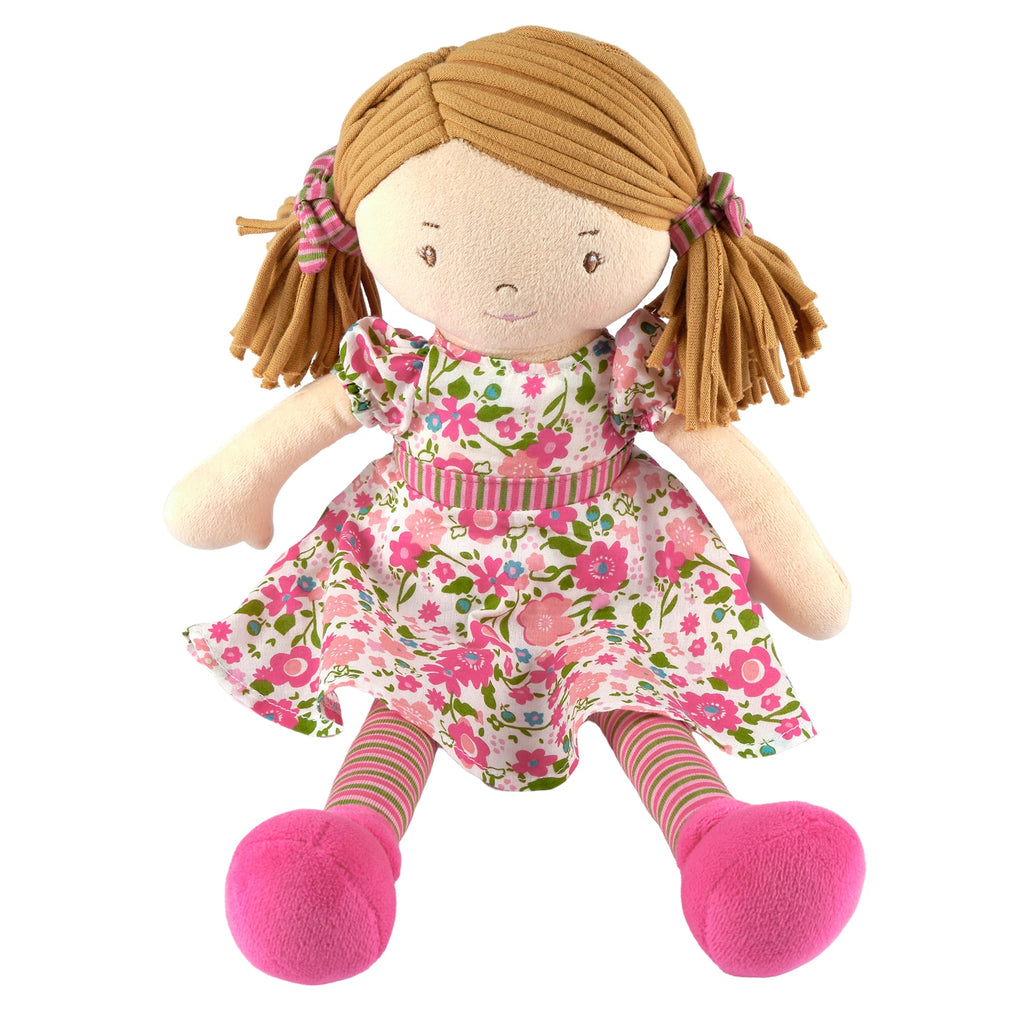 Hellbraunhaarige Rag-Doll-Puppe im dunkelrosa und grünen Kleid