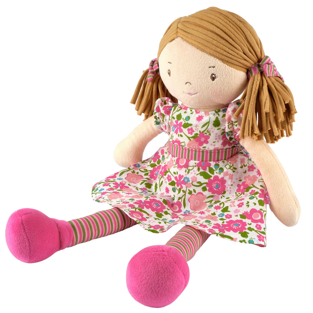 Hellbraunhaarige Rag-Doll-Puppe im dunkelrosa und grünen Kleid
