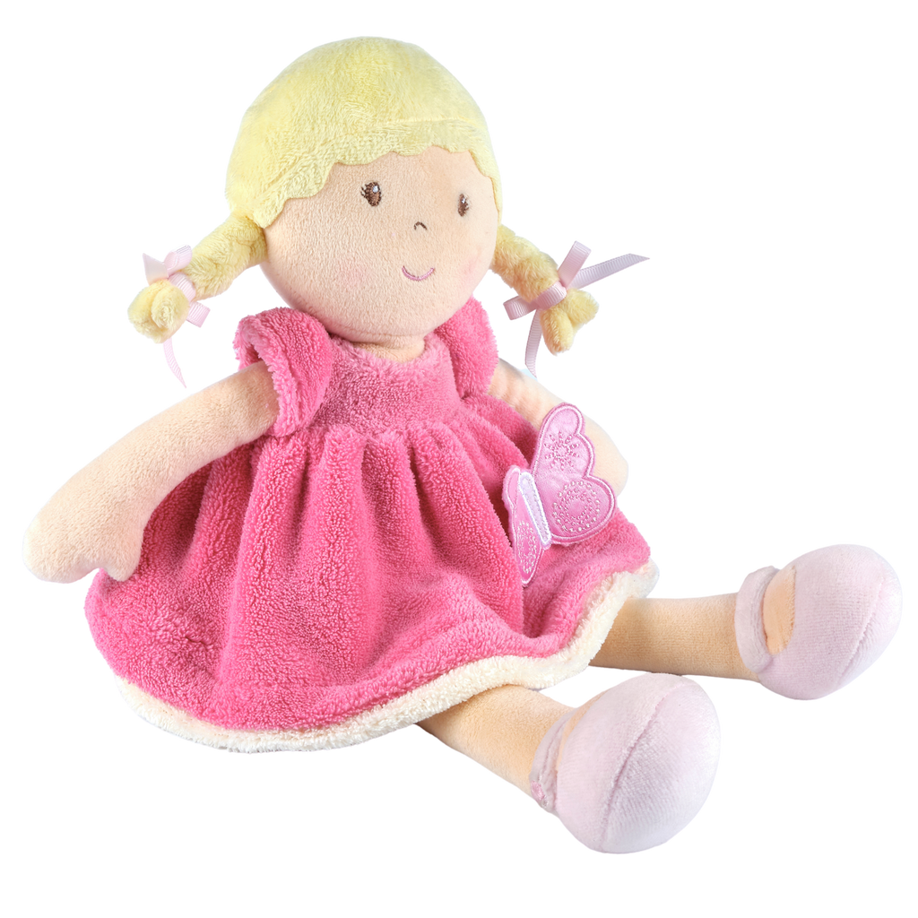 Poupée douce aux cheveux blonds en robe rose et blanche
