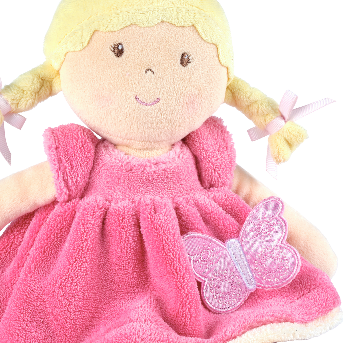 Poupée douce aux cheveux blonds en robe rose et blanche