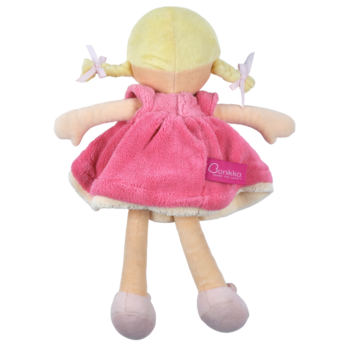 Poupée douce aux cheveux blonds en robe rose et blanche