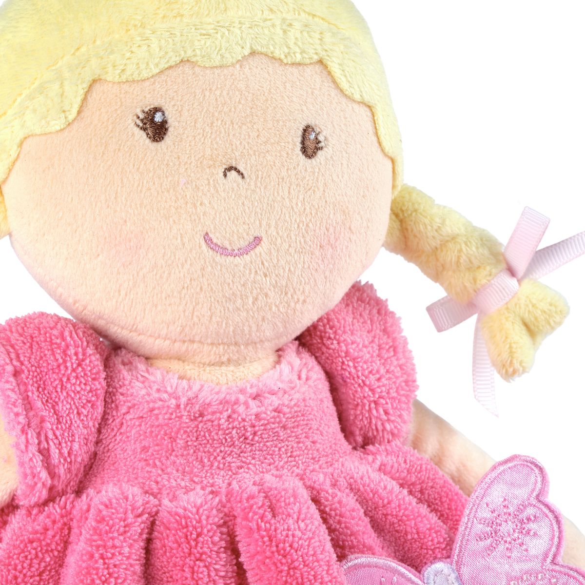 Poupée douce aux cheveux blonds en robe rose et blanche